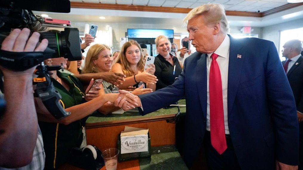 FILE - Former President Donald Trump greets supporters at Versailles restaurant on Tuesday, June 13, 2023, in Miami. (AP Photo/Alex Brandon)