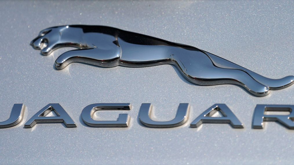 FILE - In this file photo dated Sunday, Sept. 6, 2020, the Jaguar car company logo shines off the deck of an I-Pace electric vehicle at a Jaguar dealership, in Littleton, USA. (AP Photo/David Zalubowski, FILE)