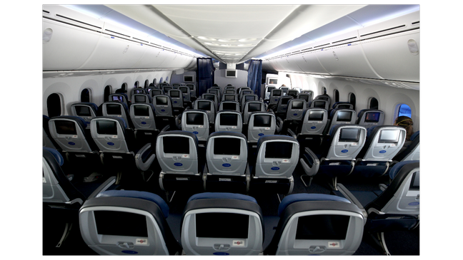 FILE – Rows of empty seats on an airplane. (Getty Images)